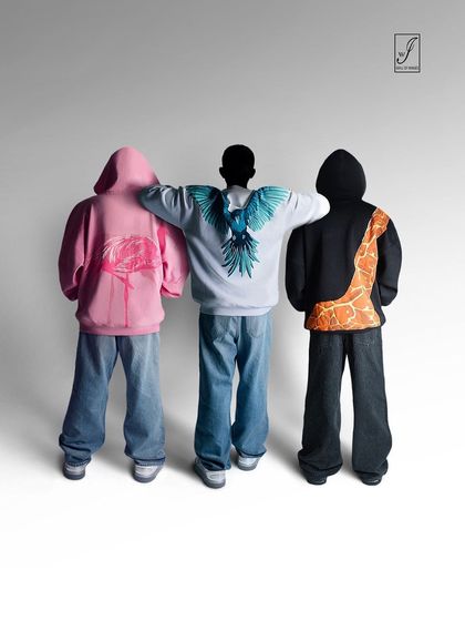 An experimental "invisible fashion" shoot for a streetwear brand. This concept focuses on the clothing itself by rendering the models as silhouettes, making the graphic hoodies the undeniable heroes of the image.