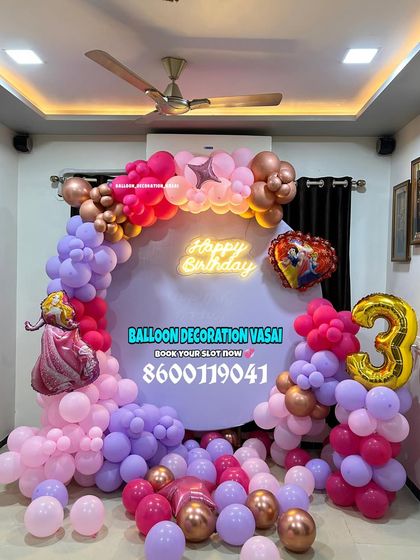 A Cinderella theme for a 3rd birthday. This ring decoration includes a princess cutout, a number '3' foil balloon, and a vibrant balloon garland.