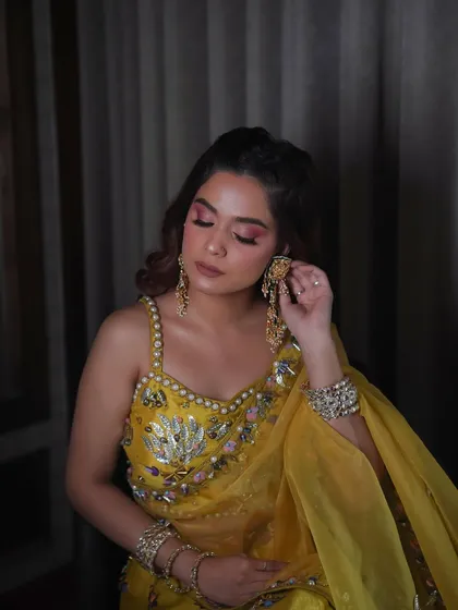 A close-up of the pink and yellow haldi look. The colors are blended seamlessly for a look that is bold yet soft.