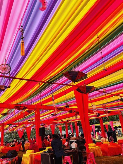 A Rajasthani Mela theme in full swing. The colorful ceiling draping with hanging umbrellas and dreamcatchers created a festive and traditional atmosphere.