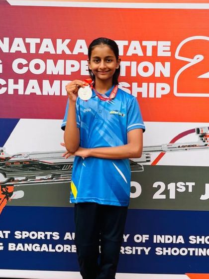 Sanvi with her well-earned medal at the Karnataka State Shooting Competition, a result of her dedicated practice in the 10m air rifle event.
