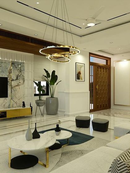 A wider shot of the living room, showing the Ganesha wall art and the seamless transition to the main door.