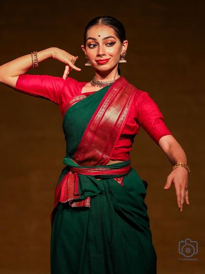 A still from my Bharatanatyam performance at Navarasotsava. This pose captures a moment of storytelling, where the hands, eyes, and expression all work together.