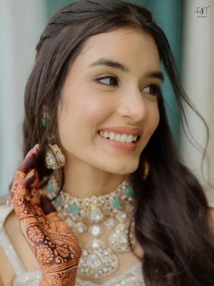 My philosophy is all about skin that looks like skin. For Moksha, I focused on creating a luminous, dewy base that let her natural beauty shine through. This close-up shows the fresh, radiant finish that is my signature.