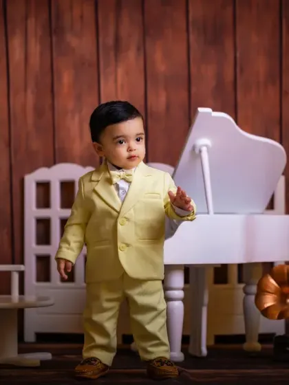 Looking very distinguished in his suit, this little boy is ready for his concert.