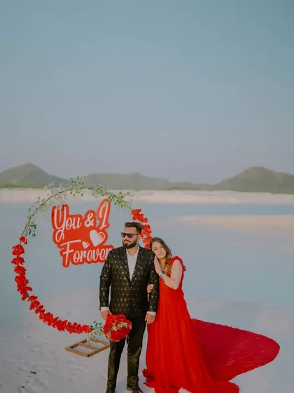 A beautiful portrait of the newly engaged couple. The "You & I Forever" sign is a perfect addition to this romantic setup, celebrating their commitment.