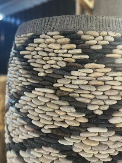 Another close-up showing the meticulous craftsmanship of the black and white pebble design.