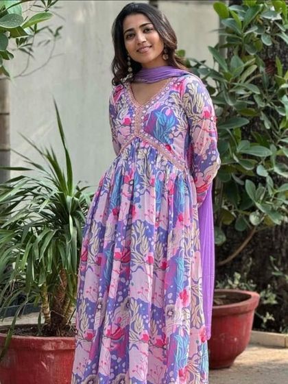 A vibrant and playful multicolor kurta pant set. The floral and abstract print in shades of purple and blue makes it a unique piece for your wardrobe.