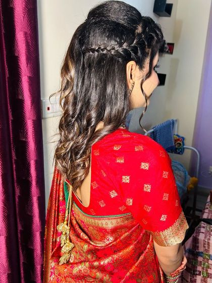 Another view of the half-up, half-down style, showing the beautiful curls.