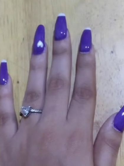 Another view of this bold purple set, showing the heart-shaped ring on the client's hand which matches the nail art perfectly. It's all in the details.