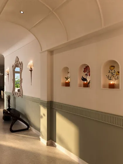 Arched niches with floral paintings and candles add a soft, artistic touch to the hallway, turning a simple passageway into a gallery of beautiful moments.