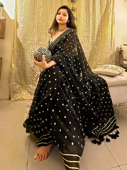 A full view of my black sequin saree. The way it drapes and catches the light makes it perfect for a wedding reception or a formal evening party.