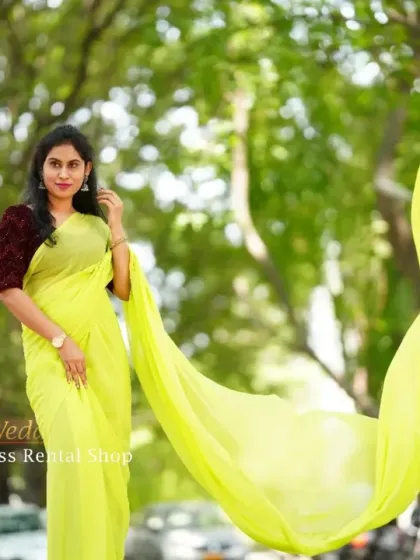 Beyond gowns, I also offer modern takes on traditional wear, like this flowing trail saree. The bright yellow georgette fabric is light and airy, with an extended pallu that catches the wind just like a flying gown, giving you a unique blend of tradition and drama.