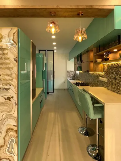 For this modular kitchen, we used our in-house factory to produce vibrant, high-gloss PU-finished cabinets. The execution included installing the patterned tile backsplash, quartz countertops, and integrated breakfast bar, all while ensuring perfect alignment and functionality with Hettich hardware.