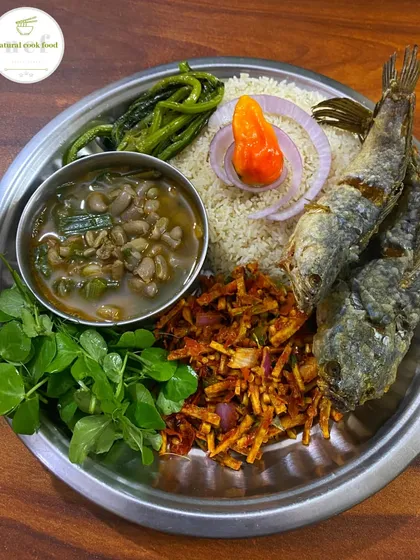 A plate featuring Chawai Kangsoi, Yongchak Singju, and other traditional Manipuri side dishes.