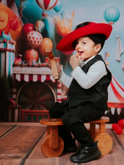 Our tiny ringmaster stealing the show for his second birthday. The carnival theme was full of color and fun, a perfect match for his energetic and playful spirit.