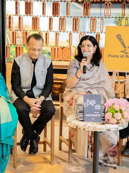 Dr. Kavita Pania discusses her Hindi poetry collection, "Kyon Sanvarti Ho," surrounded by her family, highlighting the family-friendly nature of our events.