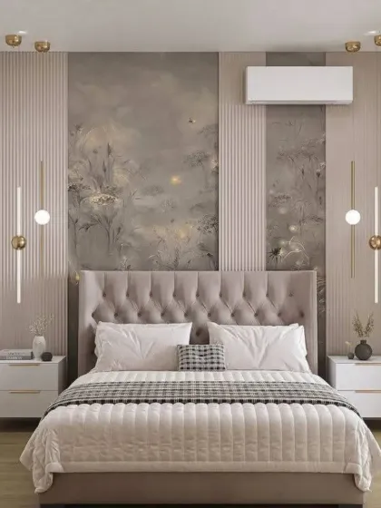 A serene bedroom featuring a tufted grey headboard set against a beautiful, artistic wallpaper. The vertical fluted panels and modern wall lights add a touch of contemporary elegance.