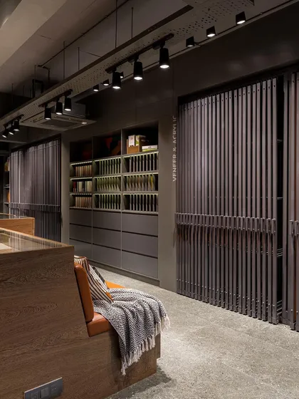 The sliding veneer display system is both a functional tool and a beautiful design element in its own right.