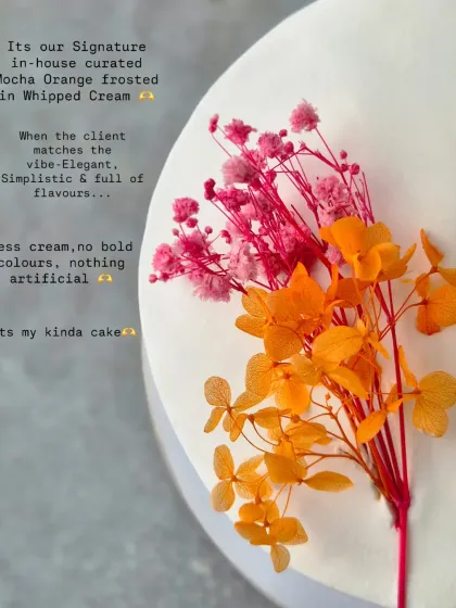 A close-up of my Mocha Orange cake, decorated with a simple sprig of dried flowers. This is my kind of cake: elegant, minimalistic, and full of flavour.