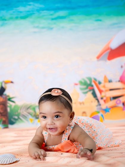A close-up of this happy baby during her beach-themed half-birthday session. Her smile is as bright as the summer sun!