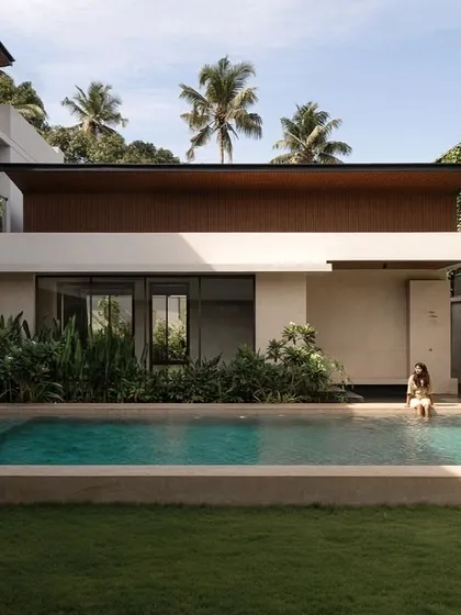 A quiet moment at the Villa Shakthi pool court, where the architecture provides both shade and openness. We carefully integrate landscape elements like climbing vines and lush planters to soften the structure and create a sense of tranquility.
