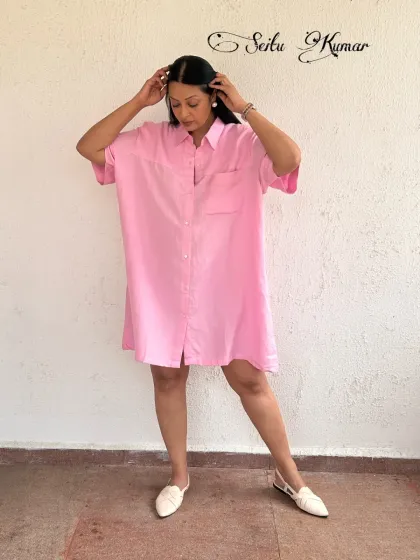 Introducing a piece from my own label, Seitu Kumar. This pink linen-blend shirt dress is designed for comfort and style, with a relaxed fit and practical pockets. It’s a versatile staple that can be dressed up or down.