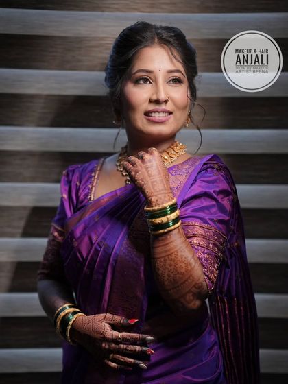 Akshaya looking serene and beautiful for her pre-wedding ceremony. The soft lighting highlights the glowing makeup look created by artist Anjali.