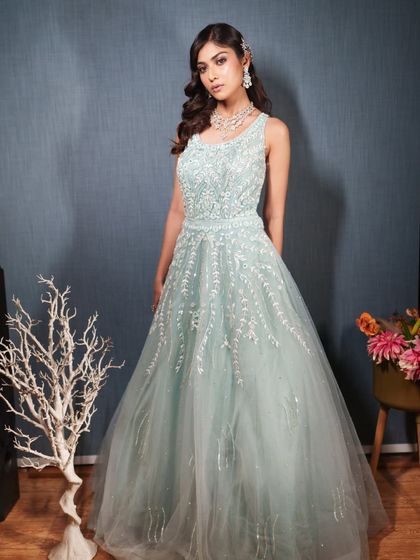 A confident pose in our beautiful blue rental gown.