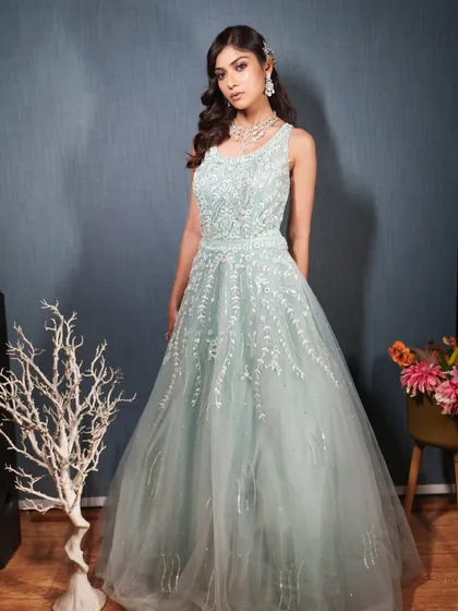A confident front-facing pose in the mint green rental gown.
