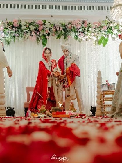 A low-angle shot of the Pheras, with the path covered in red rose petals, adding a touch of romance and drama.