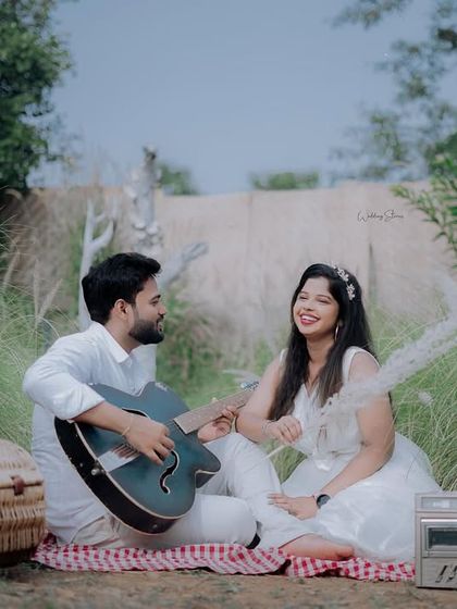 Another shot from the musical picnic, this one captures a moment of shared laughter and happiness.