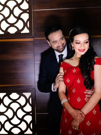 Another lovely portrait of the couple, showcasing their elegant reception outfits and the beautiful chemistry between them.