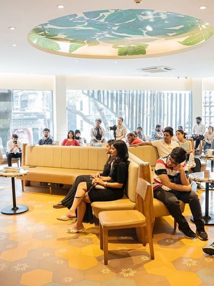 A full view of the event space for Ashish Godya's book launch, demonstrating how we transform a cafe into a professional literary event venue.