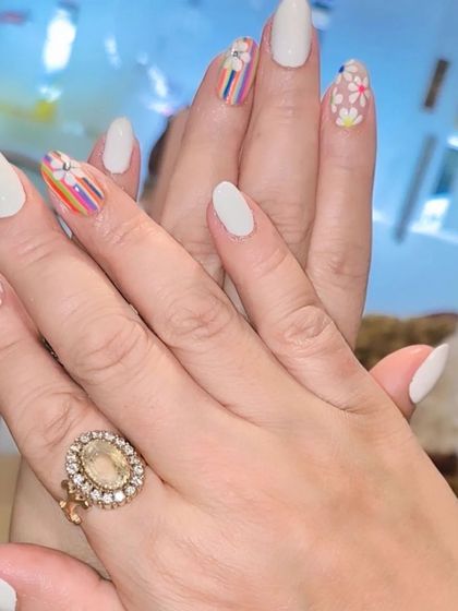 The full set of the white, daisy, and rainbow stripe design, showing how the different patterns work together for a cohesive and pretty look.