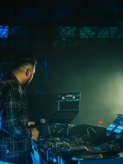 Another angle from my Homegrown Festival set, showing my full DJ setup with the stage lights creating a powerful backdrop.