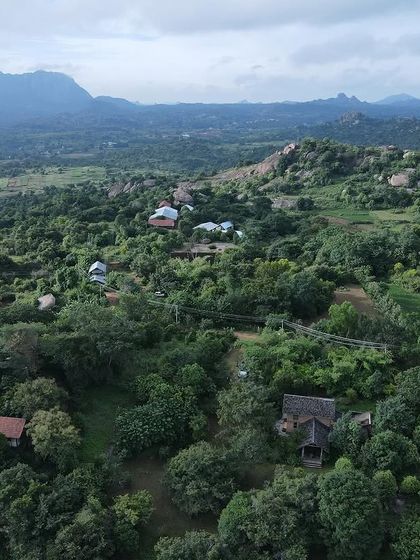 An aerial view of my studio farm, "Bandethota," near Magadi. This is where I practice conscious living and sustainable agriculture, which deeply informs my architectural work.