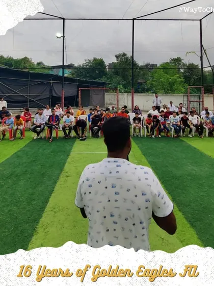 A coach addressing players and parents during our 16th-anniversary event. Our academy is built on a strong community of players, coaches, and supportive families.