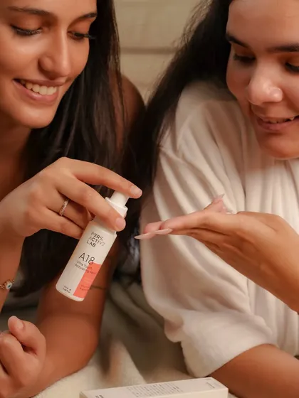 We capture authentic interactions, like two friends sharing a skincare moment. This image conveys a sense of community and trust, suggesting the product is good enough to recommend to a friend.
