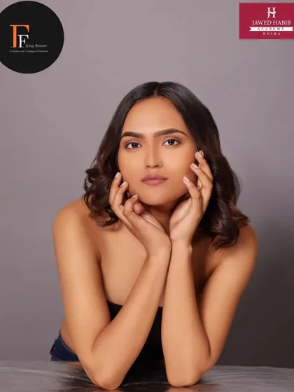 A minimalist and clean makeup look on a model for a portfolio shoot, demonstrating the "less is more" approach.