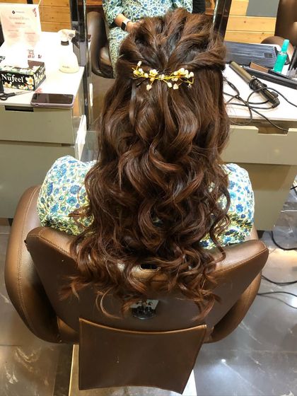 The full view of the half-updo, perfect for clients who want their hair down but with an element of formal styling.