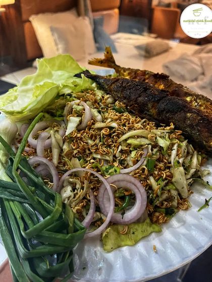 A simple and delicious plate of mimi singju (noodle salad) served with a whole fried fish. Singju is everything!