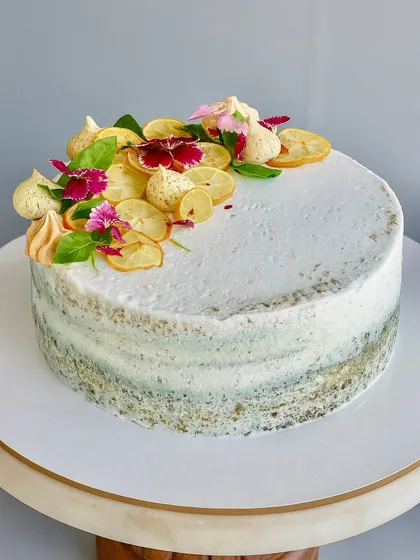 Zesty, herby, and unapologetically unique. My Lemon Basil Naked Cake is made with a light lemon basil sponge, balanced with lemon curd, and topped with candied lemons and fresh basil leaves for an adventurous dessert.