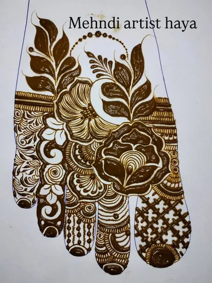 A practice sheet of a beautiful foot design. This piece is filled with bold flowers and leaves, covering the top of the foot in an elegant, asymmetrical pattern.