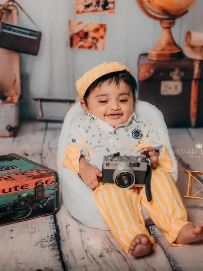 This little traveler is also a budding photographer. I love incorporating props that reflect the family's passions.
