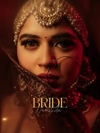 A powerful close-up 얼굴 of Vanshita, her gaze direct and confident, her face framed by her veil and jewelry.