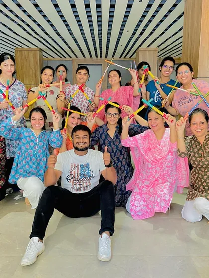 The happy faces after a successful Dandiya workshop. This photo captures the sense of community and accomplishment my students feel after learning a new routine together.