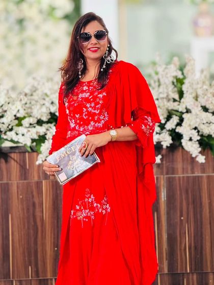 A smiling shot in my red ensemble. Confidence is key, and the right outfit helps me shine.
