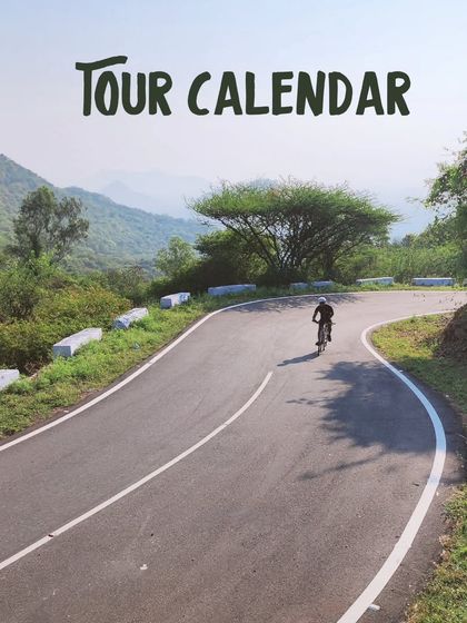 Our tour calendar is your gateway to adventure. This image of a cyclist on a winding mountain road represents the promise of exploration and discovery that defines our multi-day tours.