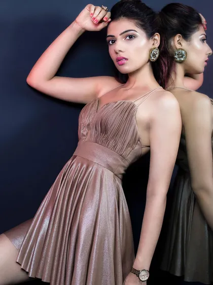 This metallic gold party dress is designed to turn heads. The ruched fabric and flattering silhouette make it a perfect choice for a night out, a birthday celebration, or any glamorous event.
